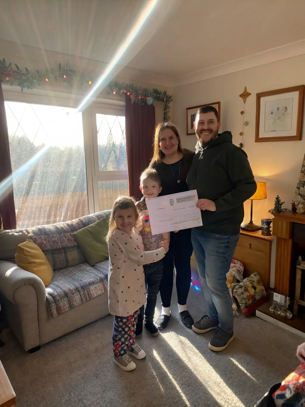 A family touring a potential new home with Mitzi Turner, pointing out features and discussing the property's potential, illustrating the showing process.